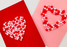 Turn your heart upside down and fold the top of the heart almost all the way to where the base of the triangle starts. 3d Valentines Day Pom Pom Card Kids Crafts