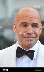 Baldness tuxedo white jacket bow tie actor hi-res stock photography and  images