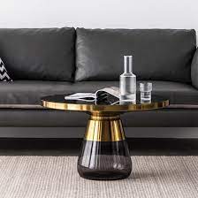 The table top is etched metal surrounded by a medium. Home Furniture Transparent Glass Round Top Metal Stainless Steel Gold Color Side Living Room Tempered Glass Base Art Coffee Table China Glass Coffee Table Retro Vase Round Glass Table Made In China Com
