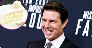 It is a cake frosted with a white frosting and covered in coconut flakes. Coconut Cake For All These Stars Have Gotten The Dessert From Tom Cruise Flipboard