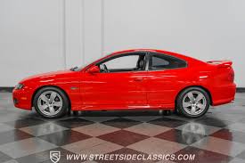 Image result for Medium Red 2004 Pontiac