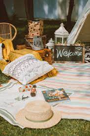 Our social distance picnic party comes complete with an entire picnic set up including extra space, blankets, pillows, parasols, and even corn hole! Simple Ideas For A Hip Picnic Party