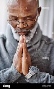 African man praying home hi-res stock photography and images