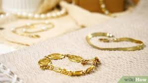 Dish detergent is the best option for cleaning your gold jewelry because it's less abrasive than other cleaners. 4 Ways To Clean Gold Jewelry Wikihow