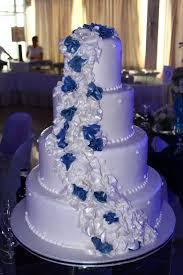 4 Layer White Wedding Cake With Cascading White And Navy Blue Ruffles White Wedding Cakes White Wedding Cake Wedding Cakes