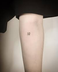 Tiny Number 32 Tattoo By Kirk Budden Inked On The Left Forearm Tattoos Dainty Tattoos Minimalist Tattoo
