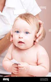 Seven Month Baby Girl Head And Neck Are Manipulated By Osteopathic Or Chiropractic Manual Therapist Stock Photo Alamy