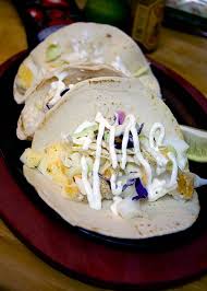 Get the grilled coconut lime tilapia tacos with kiwi salsa recipe by how sweet it is. Fish Tacos With Spicy Sour Cream