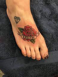 A Traditional Red Rose W Banner And Name Foot Tattoo Seashell Tattoos Tattoos Foot Tattoo