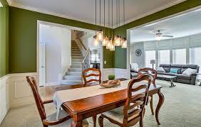 Dining Room With Olive Green Paint And White Wainscoting Brown Dining Room Interior Design Dining Room Green Dining Room