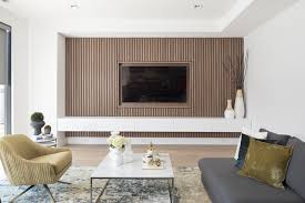 Design Detail A Wood Slat Accent Wall Surrounds The Tv In This Living Room Accent Walls In Living Room White Walls Living Room Feature Wall Living Room