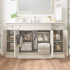 A wall of tiny mosaic tiles is punctuated by a dark wood vanity cabinet in this small bathroom.the cabinet's deep construction allows for plenty of storage despite the necessary undersink plumbing. 50 Nifty Bathroom Storage Ideas And Designs Renoguide Australian Renovation Ideas And Inspiration