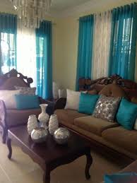 They're two very beautiful colors and they go really well together. Brown Couch Teal White Silver Accents Decor Home Living Room Brown Home Decor Living Room Decor Apartment