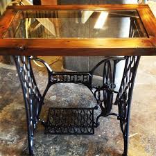 An Antique Singer Treadle Sewing Machine Base Finds New Life As A Table With The Addition Of Vint Singer Sewing Machine Table Singer Sewing Tables Sewing Table
