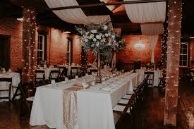 The Booking House Sparrow Lace Wedding Reception Ceremony Wedding Venue W Brick Wedding Venue Warehouse Wedding Reception Wedding Table Flower Centerpieces