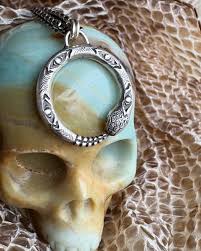 Almost done with this locket! It has been a long time in the works. I was  given free reign to make a locket, incorporating a snake, moonstone, and  runes. It needed to