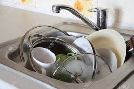 unwashed kitchen appliances filled