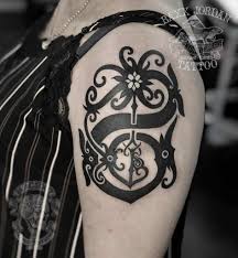 Uk tv personality has tattoo of three crowns on her ankle and heart shaped design on nape of neck: 40 Dayak Tattoos Origins Meanings More
