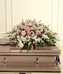 Casket or coffin sprays are large arrangements of flowers that are approximately 4 feet long and are elegantly draped on the casket. An Elegant Tribute Casket Spray At From You Flowers