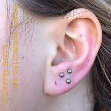 Get My Earlobes Sewn Up Once They Heal Do Triple Lobe Piercings Not This Placement Down Lowe Earings Piercings Triple Ear Piercing Body Jewelry Piercing