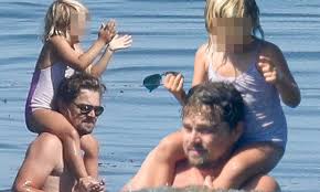 Leonardo dicaprio lists his west village bachelor pad/wellness retreat for $8.5m leo dicaprio's west village wellness retreat can be yours for $8.5m. Leonardo Dicaprio Puts A Pint Sized Family Member On His Shoulders As He Takes A Dip In The Ocean Daily Mail Online