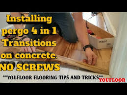 Black vinyl tile and pergo laminate flooring. Installing Pergo 4 In 1 Transitions On Concrete With No Screws Youtube