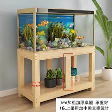 A shelf is a flat, hard, raised horizontal surface used as a store display, supported by a rack and hinged to a wall. Usd 21 61 Fish Tank Bottom Cabinet Cabinet Aquarium Shelf Fish Tank Table Non Solid Wood Base Fish Tank Rack Solid Wood Fish Tank Shelf Wholesale From China Online Shopping Buy Asian