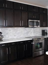 Quartz countertops come with a variety of advantages. Dark Kitchen Cabinets With White Subway Tile Backsplash Home Design