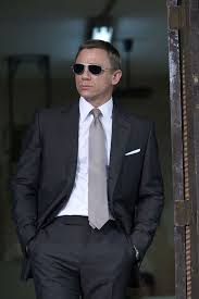 том форд Savile Row The Master Tailors Of British Bespoke Charcoal Two Piece Suit With White Dress Shirt Silver Tie White Pocket Square And Black Aviator Sunglasses In 2020 Daniel Craig Suits Mens Suits Online