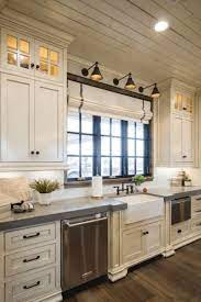 Black and glass lanterns will complement the look together with salt and pepper granite countertops. 10 Antique White Kitchen Cabinets That Jazz Your Kitchen Up