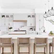 You don't want to bump into the person cooking at the range, and you want to maximize counter space to one side of the sink. L Shaped Island With Sink And Dishwasher Design Ideas