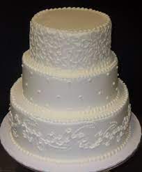 Our Buttercream Iced Cake Decorated With Swirls Dots And Tiny Flowers Traditional Wedding Cakes Cake Beautiful Wedding Cakes