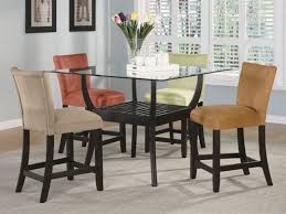 Chair seats are leather with upholstered back. 5 Piece Glass Top Counter Height Table Set In Cappuccino Finish By Coaster 100588