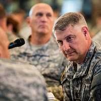 Sgt. Maj. of the Army Raymond F. Chandler III, listens