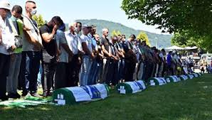 Family members could be seen grieving as they watched the stream of the trial, which took place in the hague. Srebrenica Scaled Back Ceremony Marks 25 Years Since Massacre Bbc News