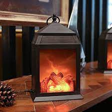 The introduction of led lights into lantern designs now makes them brighter, safer and lanterns have been around for thousands of years. Amazon Com Fireplace Lantern And Battery Operated Usb Operated 6 Hour Timer Included Tabletop Fireplace Lantern Indoor Outdoor Fireplace Lamp 1 Pack House Shape No Heater Function Size 6 3x5 5x12 Inch Kitchen Dining