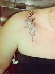 Astrology men's scorpius constellation torn skin tattoo on shoulder. Tribal Shoulder Tattoo Designs For Women