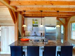 This post and beam home has an open floor plan which encompasses the living, dining room and kitchen. Houses Additions