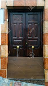 Maybe you would like to learn more about one of these? Flat Wooden Board Chained To A Front Door To Deflect Rainwater Spanish House With Wooden Doors And Tile Surround Stock Photo Picture And Royalty Free Image Image 92114363