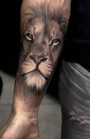 The inside of his left forearm has another colorful design tattooed on it. 20 Fierce Lion Tattoos For Men In 2021 The Trend Spotter