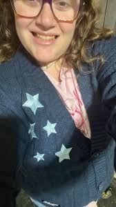 Sweater with song lyrics and eras