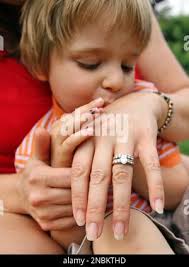 This Saturday, June 18, 2011 photo shows Kristen Burris, second from left,  and her husband Tony, second from right, as they sit with their two sons  Colton, 3, left, and Jackson, 5,