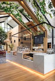 Boutique Coffee Roaster Coperaco S First Cafe Holds A Modern Tree House Modern Tree House Cafe Interior Design Coffee Shops Interior