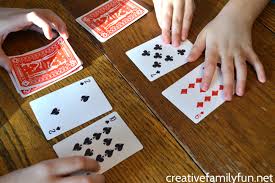 Each person gets 20 cards with 15 of their cards face down in a pile and the other 5 in another pile. Addition War Card Game Creative Family Fun