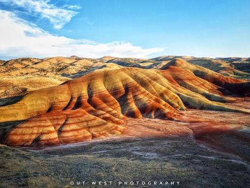 The Painted Hills! Oregon has so many beautiful landscapes! From the  amazing Coastline through the green mountains and into the interesting  desert! Near Mitchell, Oregon