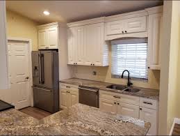 Modern kitchen cabinets coupled with open faced upper cabinets and beadboard backsplash make this kitchen look open, airy, and clean. Coastal Cream Cabinets Our Dream Kitchen