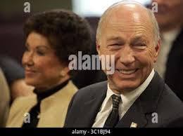 Green Bay Packers quarterback Bart Starr is led away from the team?s  clubhouse by his son, three-year-old Bret, following a training camp  session, July 19, 1967 in Green Bay, Wis. Bret often