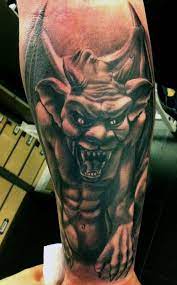 Black and grey gargoyle tattoo on left back shoulder. The History Of Gargoyles Grotesques Facts Information Pictures Going To Tehran Gargoyle Tattoo Picture Tattoos Tattoo Images