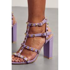 LILAC PU BLOCK HEEL WITH STUDDED STRAPS | Go Wholesale