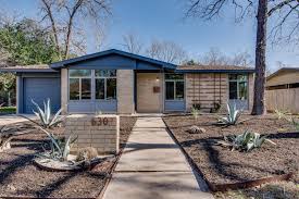 Note board and batten sides and dovecote over garage. Meet Peggy Blue A 1950s Tract House Renovation Home